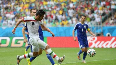 Reza Ghoochannejhad of Iran shoots and scores his team's first goal to make it 2-1 against Bosnia on Wednesday at the 2014 World Cup. Jamie McDonald / Getty Images