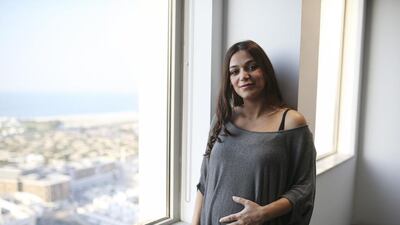 Laudy Charabaty, expecting her second child, is pleased with the longer maternity leave her company offers, saying returning to work six weeks after the birth of her first was too soon. Sarah Dea / The National