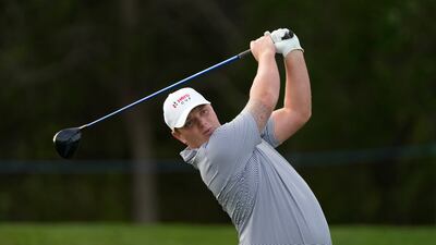 Callum Shinkwin of Great Britain and Ireland Team tees off on the 8th hole during the morning foursomes. AP