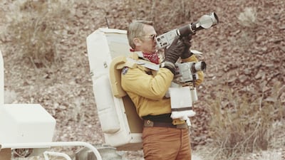 Astronaut Eugene Andrew Cernan photographs the terrain in Boulder City, Nevada, during geology training for his spaceflight in 1972
