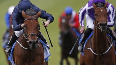 Ryan Moore riding Rhododendron, left, wins The Dubai Fillies' Mile at Newmarket Racecourse on October 7, 2016. Alan Crowhurst / Getty Images