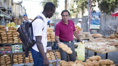 Ka’id Razem selling bread in east Jerusalem at Damascus gate.