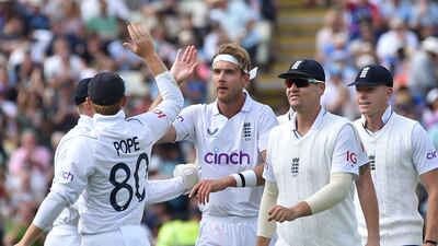England bowler Stuart Broad celebrates with teammates after dismissing India's Hanuma Vihari. AP