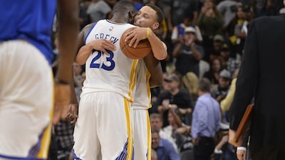 Golden State Warriors' Stephen Curry, right, and Draymond Green, shown after winning their 71st game of the season against the San Antonio last weekend. Darren Abate / AP / April 10, 2016