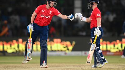 Harry Brook touches gloves with Ben Duckett. Getty