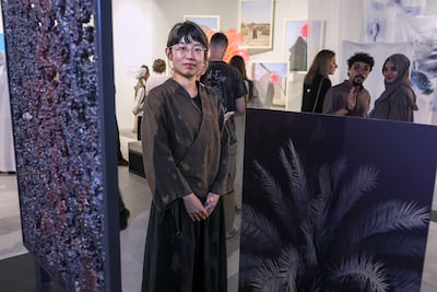 Chinese artist Yijing 'Bao' Li with her installation at Spectrum. Victor Besa / The National
