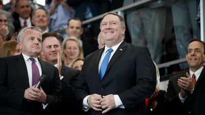 Mike Pompeo, with former acting secretary of state John Sullivan, left, arrives for his first day of work at the State Department in Washington. EPA/SHAWN THEW