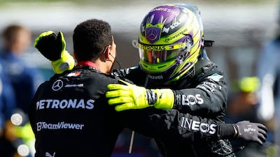 Mercedes' Lewis Hamilton celebrates after winning the race. Reuters