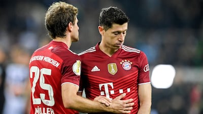 Bayern's Thomas Muller (L) and Robert Lewandowski at the end of the game. AFP