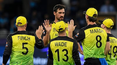 Australia's Mitchell Starc, centre, celebrates with his teammates after taking the wicket of Sri Lanka's Wanindu Hasaranga. AFP
