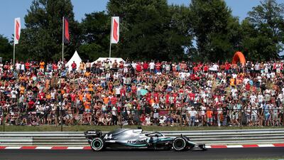 Supporters watch world champion Lewis Hamilton pass by during the 2019 Hungarian Grand Prix at the Hungaroring. The 2020 race is set to take place behind closed doors. Reuters