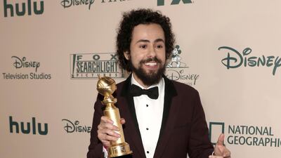 Ramy Youssef arrives at the FX and Disney Golden Globes after party clutching his award. AP