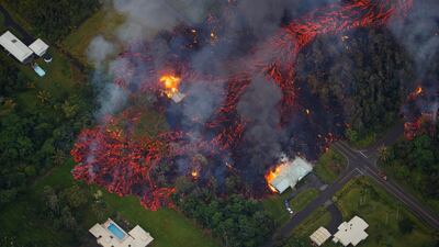 Activity continues on Kilauea's east rift zone, as a robust fissure eruption in Leilani Estates sends a massive flow into the subdivision, consuming all in its path, near Pahoa, Hawaii. Bruce Omori / Paradise Helicopters / EPA