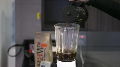 Step 5: Pour the hot, steeped coffee into a glass blender. Plastic blenders are not good for this drink as the coffee is very hot. Silvia Razgova / The National