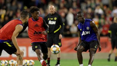 Manchester United defender Eric Bailly, right, takes part in a training session at the WACA in Perth. EPA