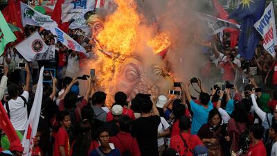 Protesters burn effigies of Philippine President Rodrigo Duterte, US President DOnald Trump and Chinese president Xi Jinping during a demonstration in Manila, Philippines. EPA