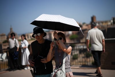 Tourists in Rome in 40°C heat. Reuters