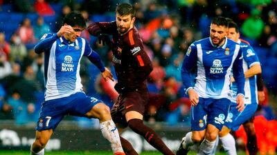 Gerard Pique has relished his role in Barcelona's rivalry with Espanyol. Pau Barrena / AFP