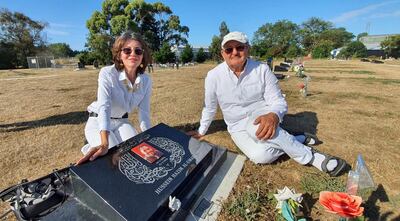 Janna Ezat and Hazim Al-Umari at their son, Hussein Al-Umari's, grave. Courtesy Janna Ezat