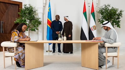 Sheikh Mohamed and Mr Tshisekedi oversee the signing onm behalf of the UAE by Minister of State Sheikh Shakhbout bin Nayhan