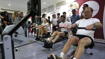 From left: Student Tahia Marshall; Sam Truman, from Tamweel central office; and Dubai British School principal Mark Ford take part in the DBS driathlon on May 12, 2016, to raise money for a voluntary school project in South Africa, called I Am Water Foundation. Jeffrey E Biteng / The National