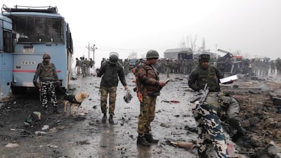 Indian soldiers examine the debris after an explosion in Lethpora in south Kashmir's Pulwama district. REUTERS