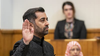 Humza Yousaf takes the oath as he is sworn in as First Minister of Scotland at the Court of Session, Edinburgh. PA