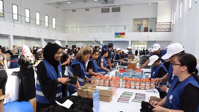 Volunteers help assemble school kits for more than 10,000 pupils. Dubai Cares