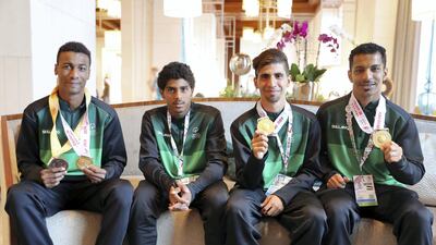 From left, Mohammed Al Olayan, Abdullah Al Jabr, Moayad Al Darwish and Mohammed Al Refai, athletes from the Saudi Special Olympics relay team Pawan Singh / The National