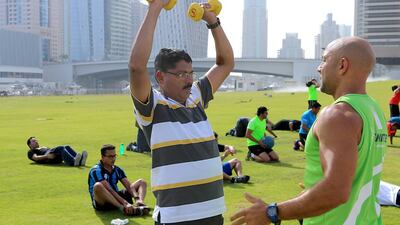 Guillame Mariole, right, instructs a group of employees from DP World in Dubai. Ravindranath K / The National