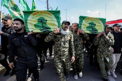 Mourners carry the coffins of members of Iraq’s Popular Mobilisation Forces, the alliance of factions that includes Iran-backed militias, during a funeral in Baghdad. They were killed in air strikes on Kirkuk, Iraq. AFP