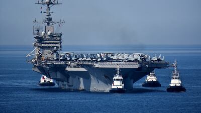 The USS Harry S Truman aircraft carrier in the Mediterranean. Its fighters could be used in air strikes against Houthi rebels, experts say. Getty Images