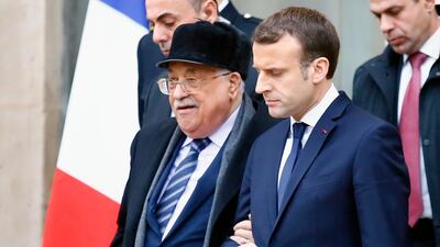 French president Emmanuel Macron, right, accompanies Palestinian president Mahmoud Abbas after their meeting at the Elysee Palace in Paris on December 22, 2017. Francois Mori / AP Photo