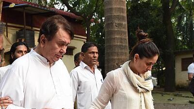 Actor Randhir Kapoor with daughter and actress Kareena Kapoor Khan attend the funeral of his mother Krishna Raj Kapoor. AFP