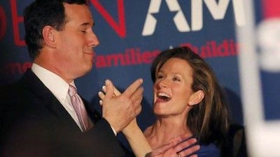 Rick Santorum celebrates with his wife, Karen, after clinching the Alabama and Mississippi primaries.