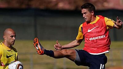 Australia's Harry Kewell, right, seems determined to take part at the Royal Bafokeng stadium today, and in the build-up was involved a fierce verbal attack on the Australian media for their criticism.