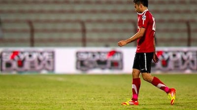 Luis Jimenez walks off the pitch after being sent off for butting a referee during Al Ahli's 2-1 win against Al Jazira.