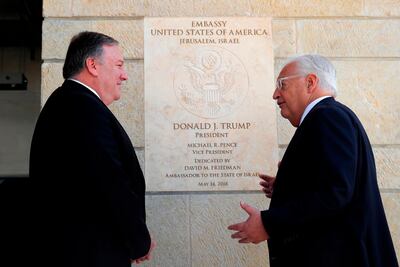US Secretary of State Mike Pompeo and US ambassador to Israel David Friedman stand next to the dedication plaque at the US embassy in Jerusalem in March. AFP