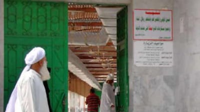 The green metal door of the 'The graveyard of our mother Eve' in Jeddah.