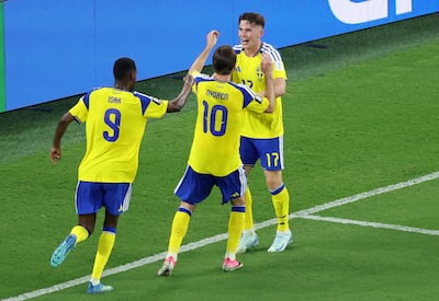 Sweden's Viktor Gyokeres, right, celebrates scoring their third goal with Benjamin Nygren and Alexander Isak. Reuters