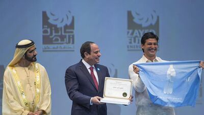 Sheikh Mohammed bin Rashid Al Maktoum Vice President and Prime Minister of the UAE and Ruler of Dubai and President Abdel Fattah El-Sisi of Egypt, present the Zayed Future Energy Prize award to Illac Diaz, Executive Director of Liter of Light during the opening ceremony of the World Future Energy Summit. Donald Weber / Crown Prince Court