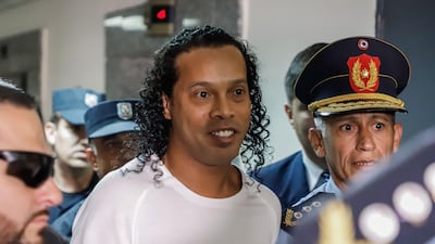 Former Brazil forward Ronaldinho arrives at Asuncion's Justice Palace to testify. EPA