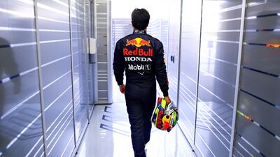 Red Bull's Mexican driver Sergio Perez walks in the garage during previews ahead of Formula 1 testing at Bahrain International Circuit in Bahrain. Getty Images
