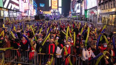 People enjoy New Year's Eve celebrations at Times Square in New York City. AFP