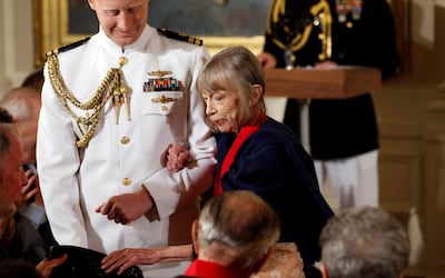 Joan Didion is escorted to her seat after then-president Barack Obama awarded her the 2012 National Humanities Medal during a ceremony at the White House in Washington in 2013. Reuters