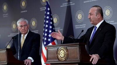 Turkish Foreign Minister Mevlut Cavusoglu and US Secretary of State Rex Tillerson respond to questions during a joint press conference following their meeting in Ankara on February 16, 2018. Adem Altan / AFP