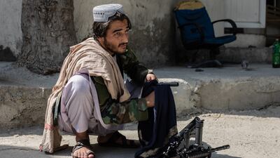 A Taliban member cleans his weapons in Kabul. Stefanie Glinski / The National