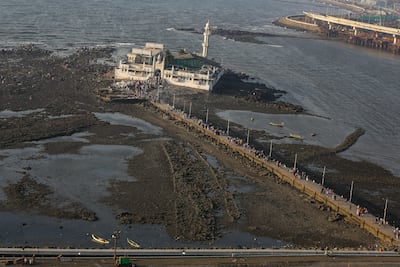 Haji Ali Dargah in Mumbai is only accessible when the tide is relatively low via a 200m-long footbridge. EPA