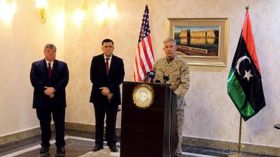 The prime minister of Libya’s Government of National Accord Fayez Al Serraj, centre, listend to Gen Thomas Waldhauser, the top US military commander overseeing troops in Africa, speak during a news conference with Peter Bodde, the US ambassador to Libya, in Tripoli on May 23, 2017. Hani Amara / Reuters