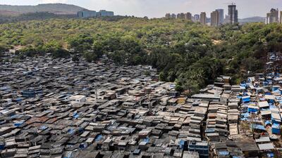 The slums in Malad, near the forest land of Sanjay Gandhi National Park, in Mumbai, India. World Earth Day is aimed at raising awareness globally about the values of biodiversity conservation and the problem of pollution. EPA